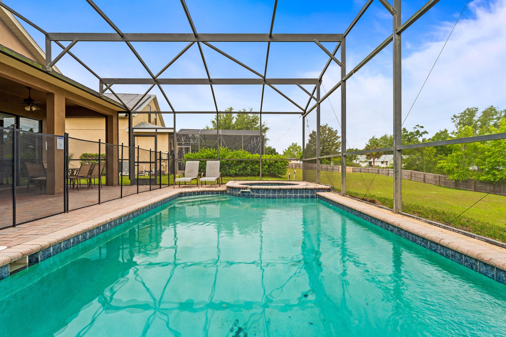 Private screened pool with outdoor seating