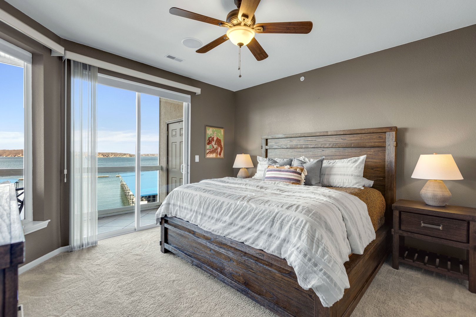 The primary suite boasts a king bed, private ensuite & deck access