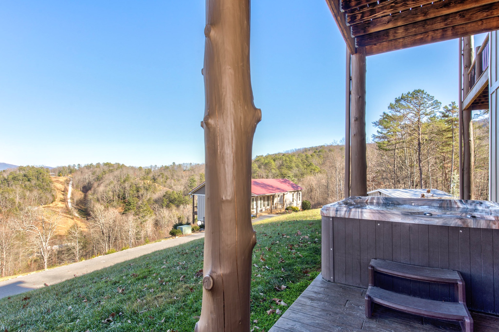 Relax and unwind in your private hot tub with a stunning view