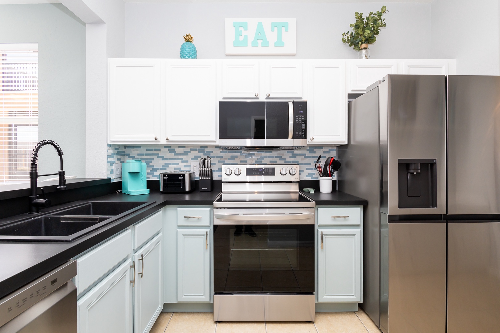 The open, airy kitchen offers ample space & all the comforts of home