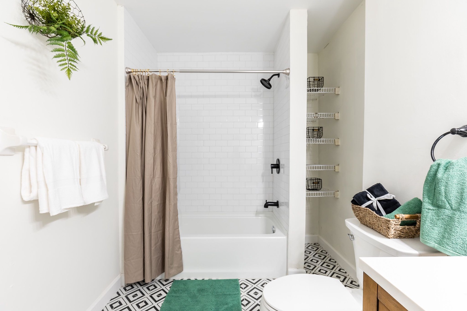 Apt 1 – The full bathroom includes a double vanity & shower/tub combo