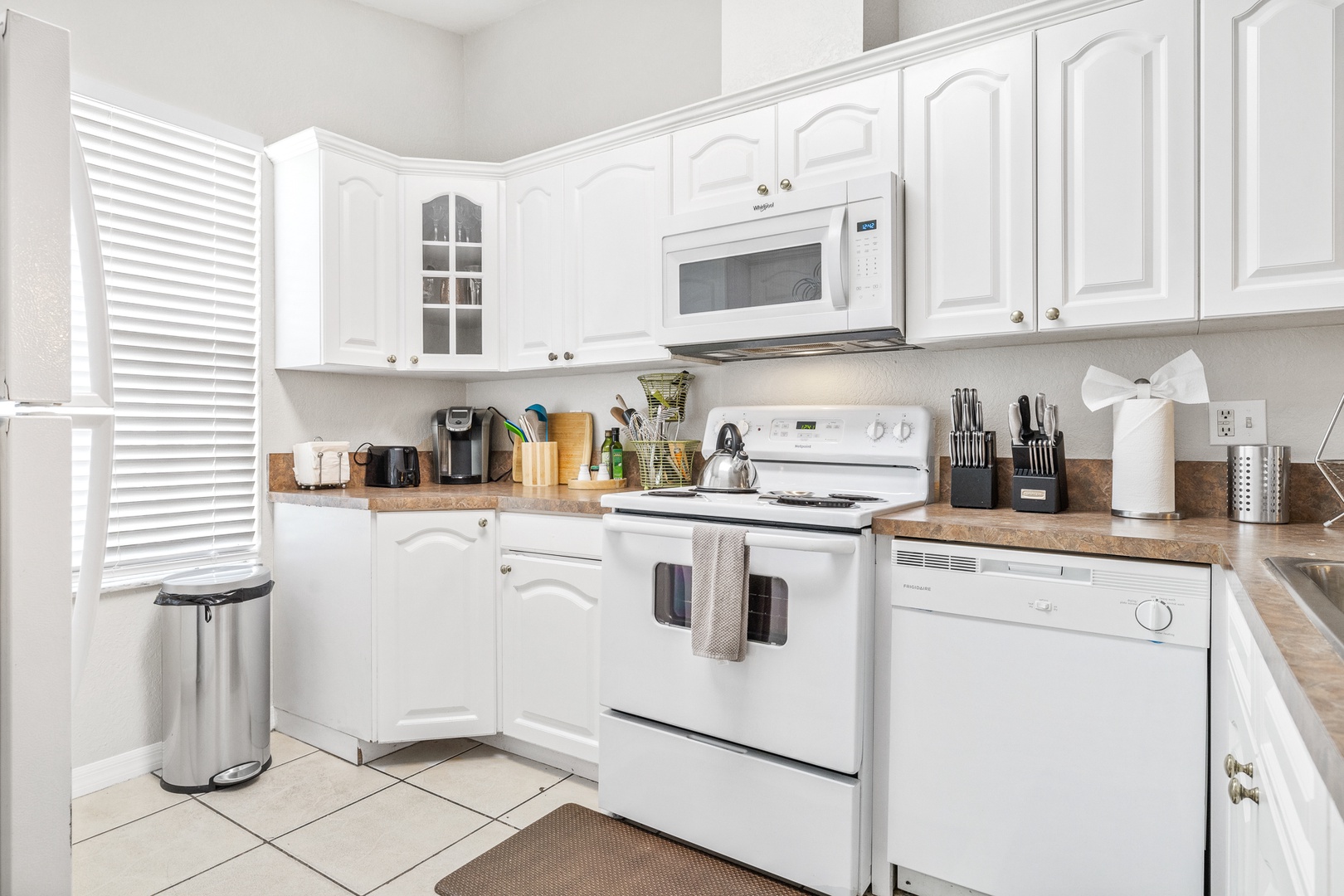 The open, airy kitchen offers ample space & all the comforts of home