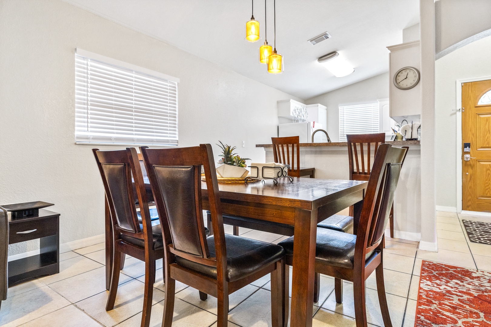 Gather for meals together at the elegant dining table, seating 6