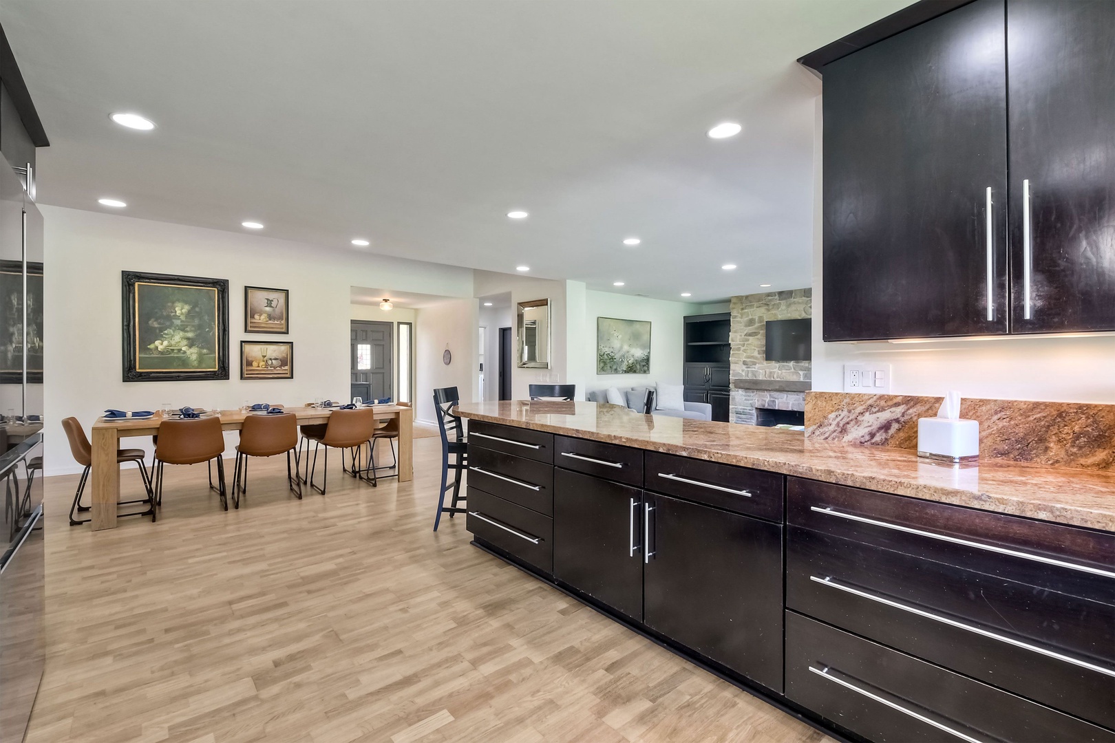 The sleek, open kitchen offers ample space & all the comforts of home