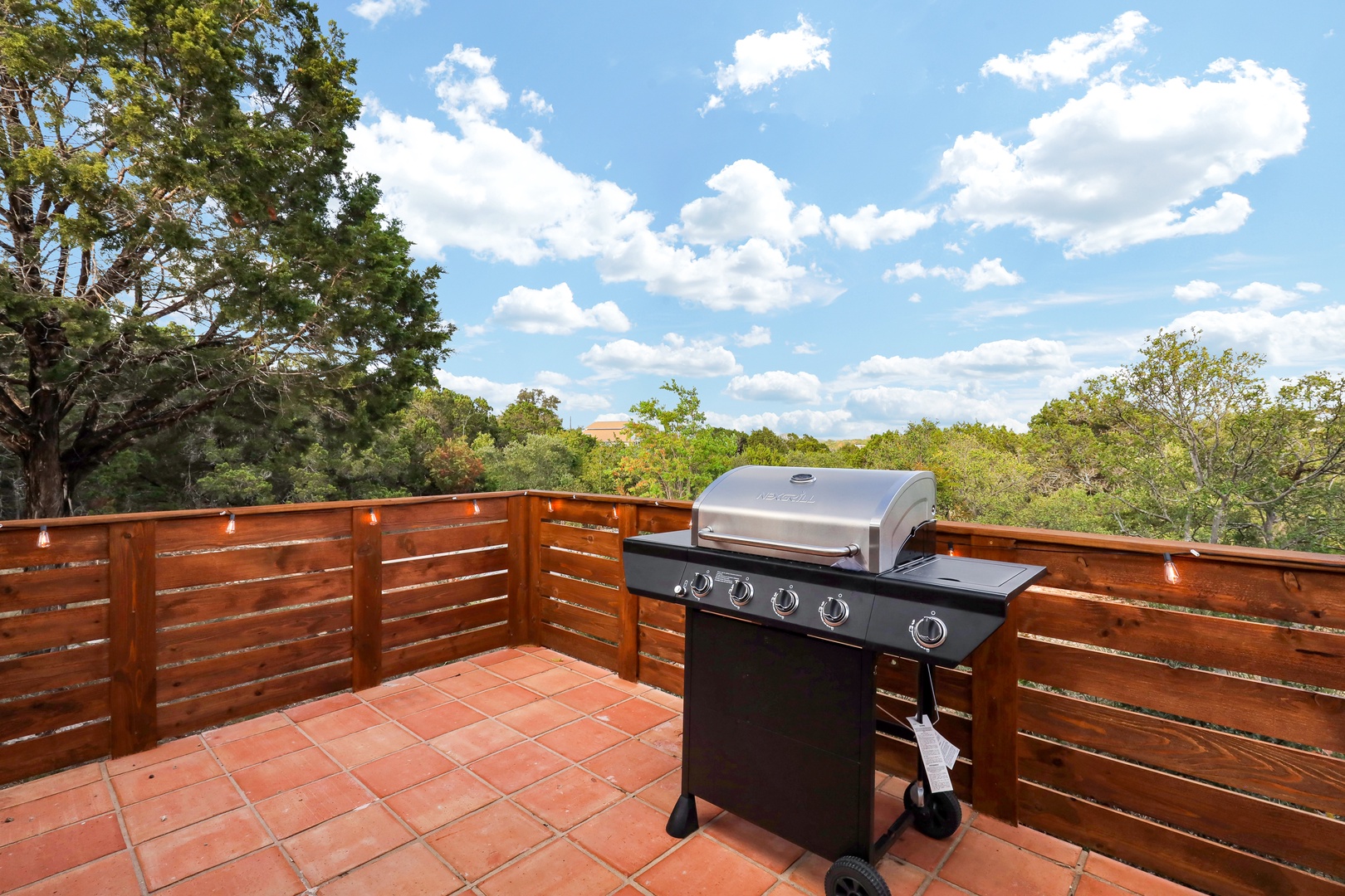 Take in stunning treetop views while you grill up a feast on the deck