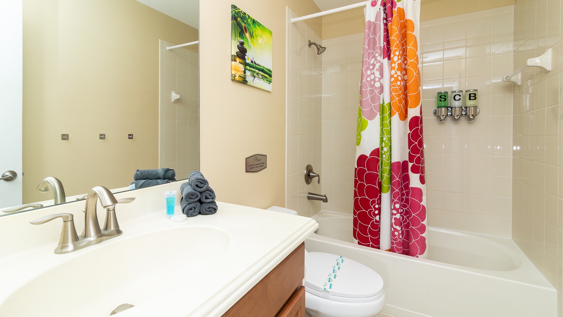 Inspire your morning routine in this hall bath, with a single vanity & showertub combo