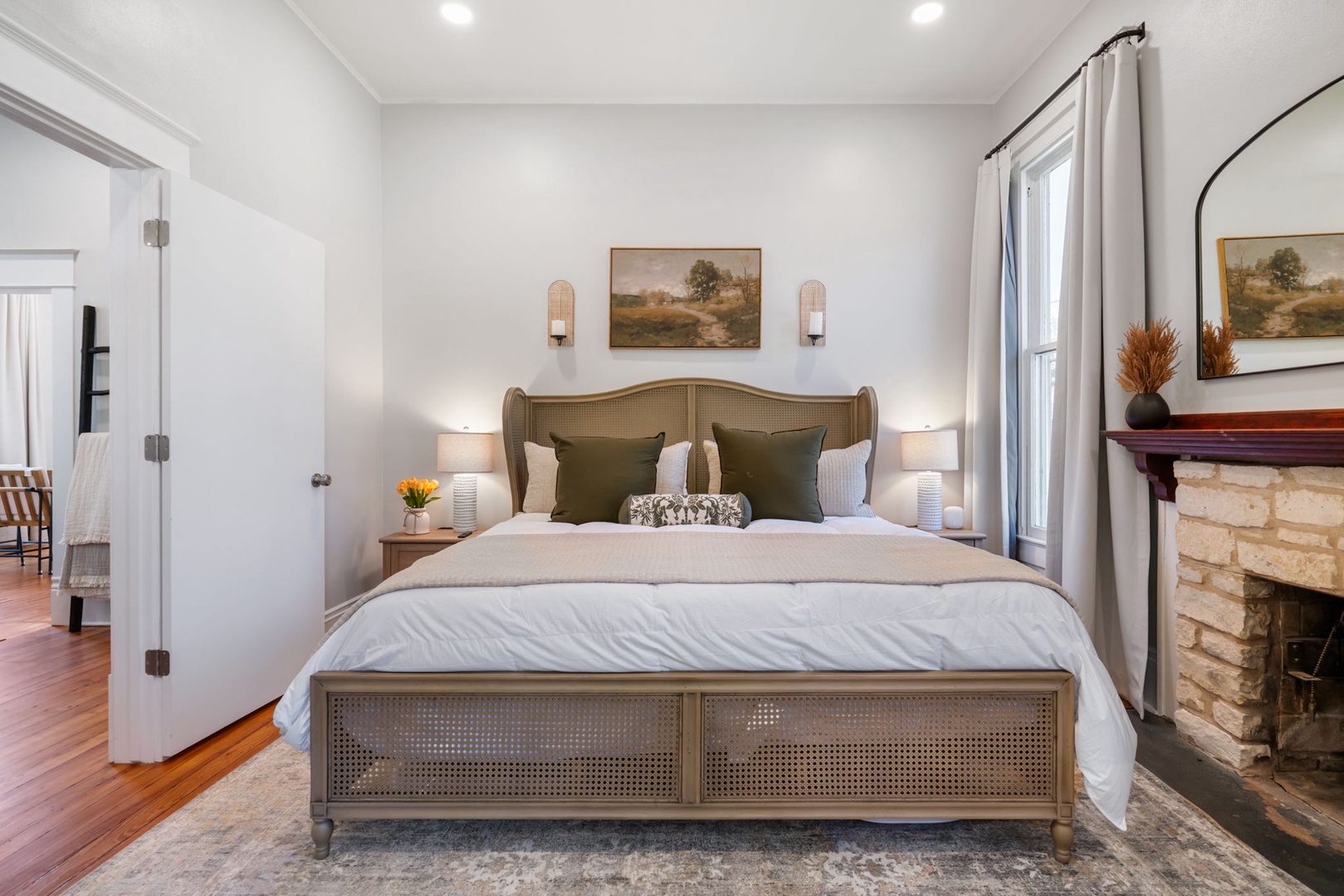 The 1st of 3 chic bedrooms, offering a plush king-sized bed & Smart TV