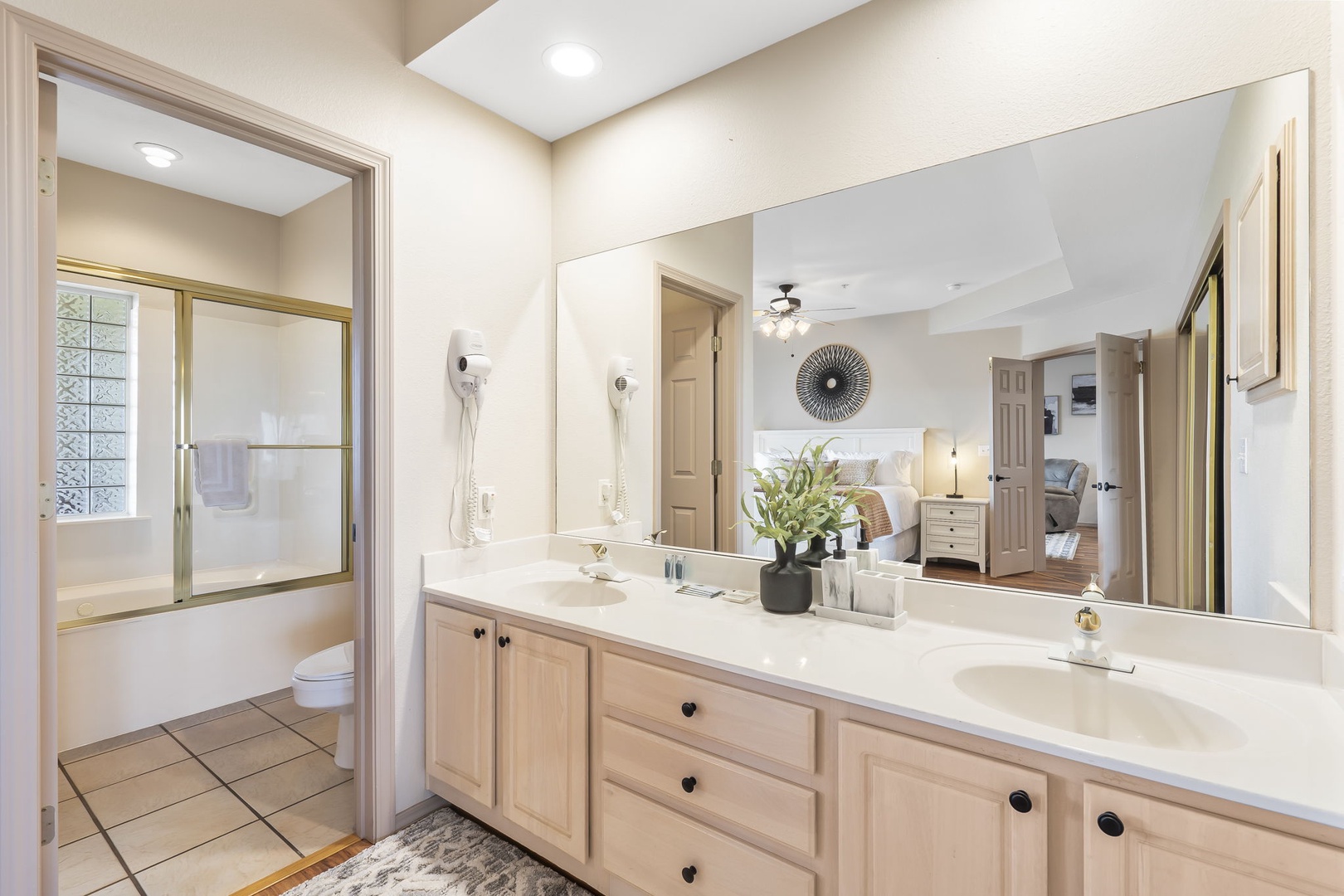 The king en suite offers an oversized double vanity & shower/tub combo