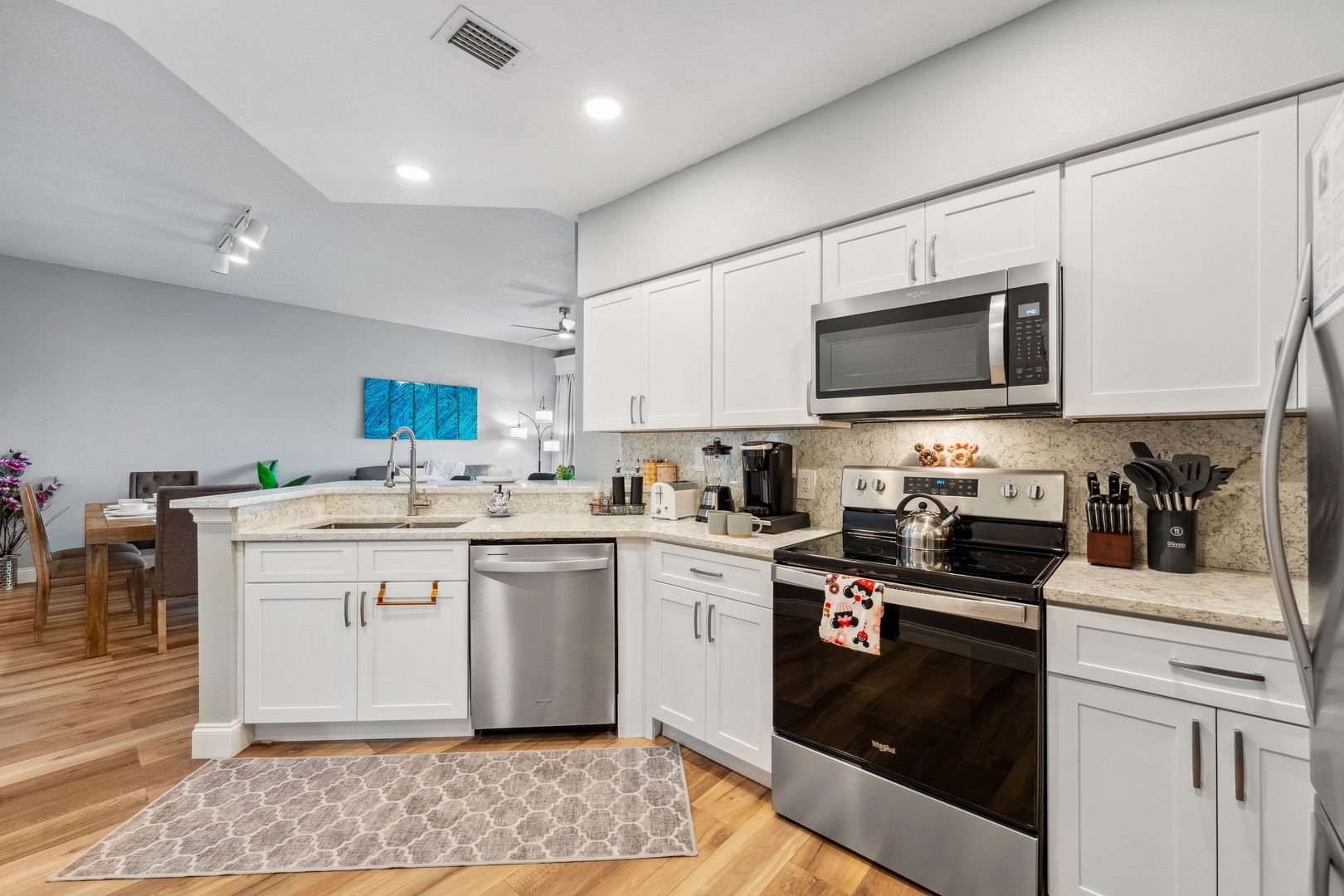 The open, airy kitchen offers ample space & every home comfort