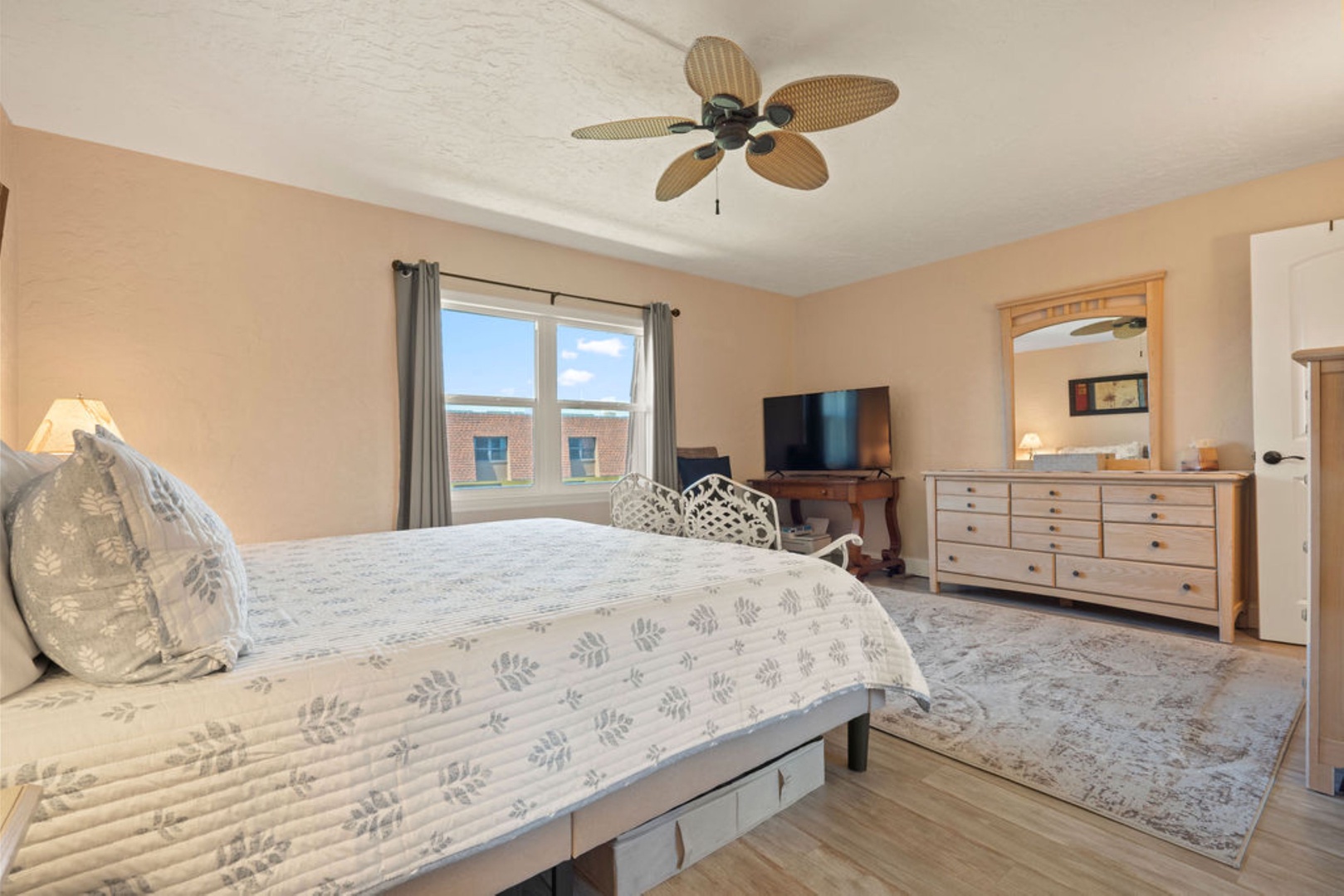 Cozy bedroom with king bed, Smart TV, and ensuite