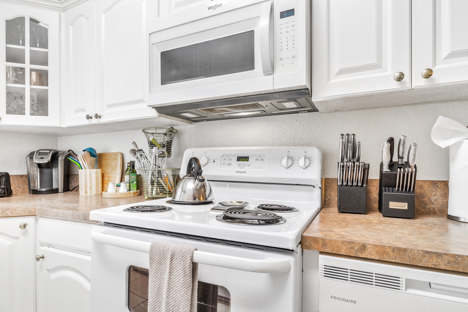 The open, airy kitchen offers ample space & all the comforts of home