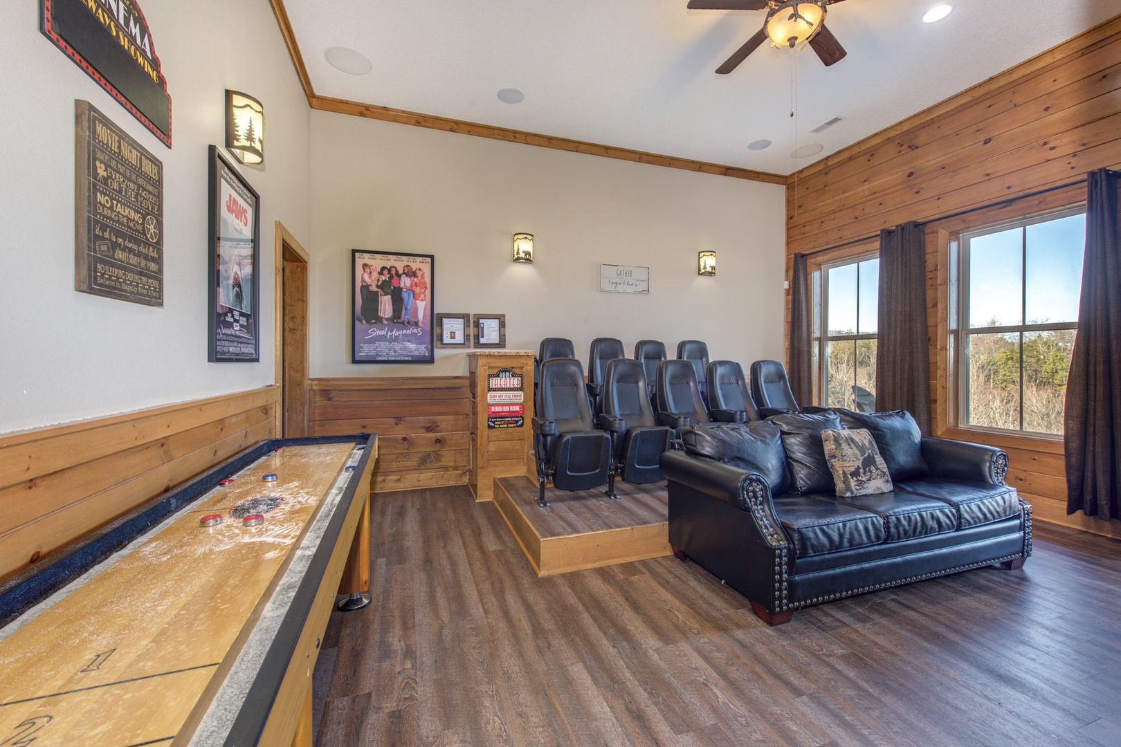 Movie & shuffleboard lovers are sure to love the downstairs theater room!