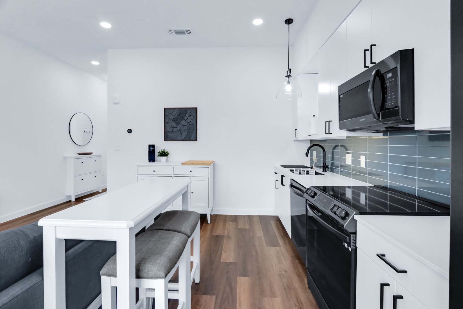 Table with stool seating for 2 and full kitchen