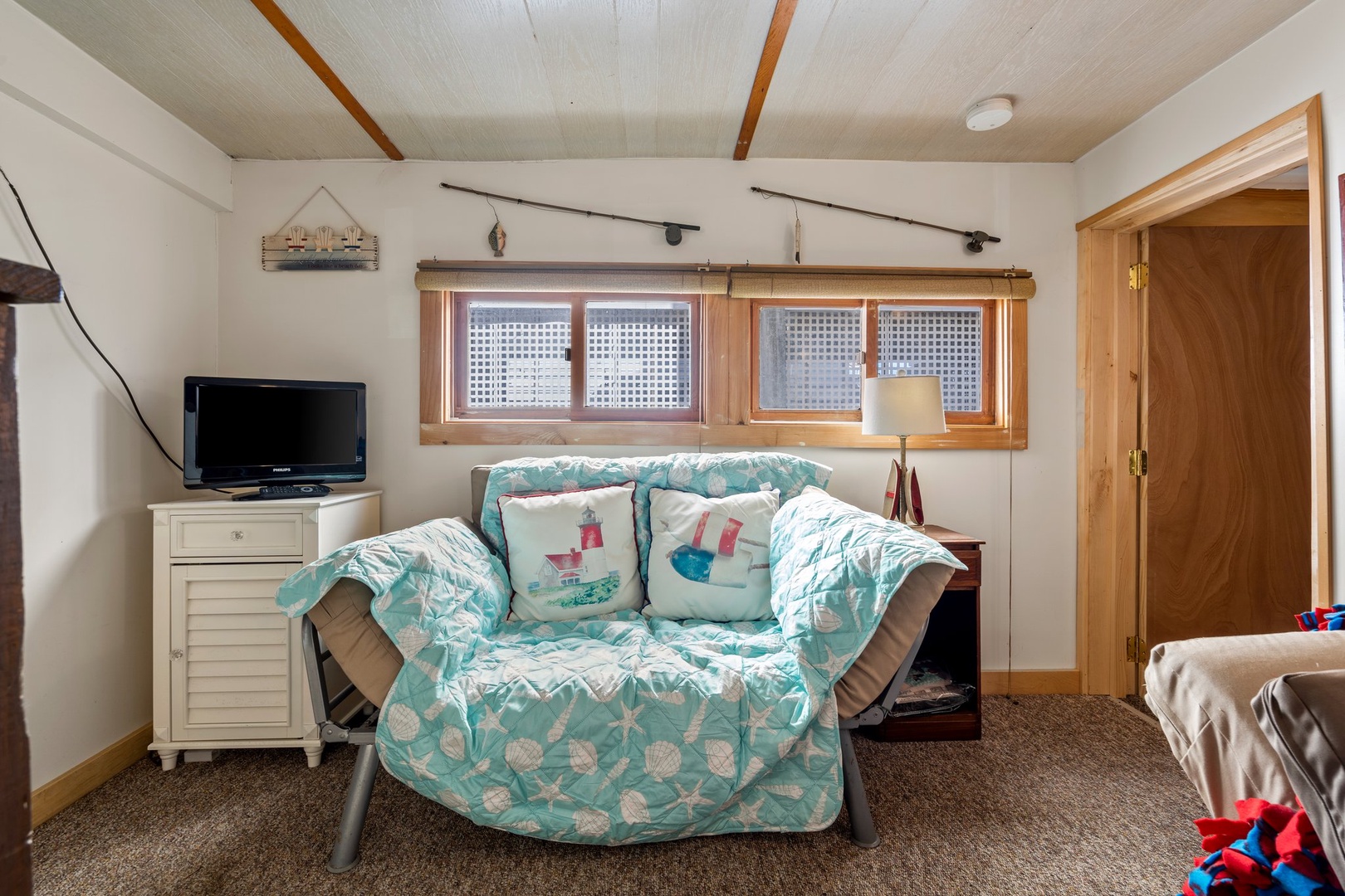 Downstairs living area with ample seating and full bathroom