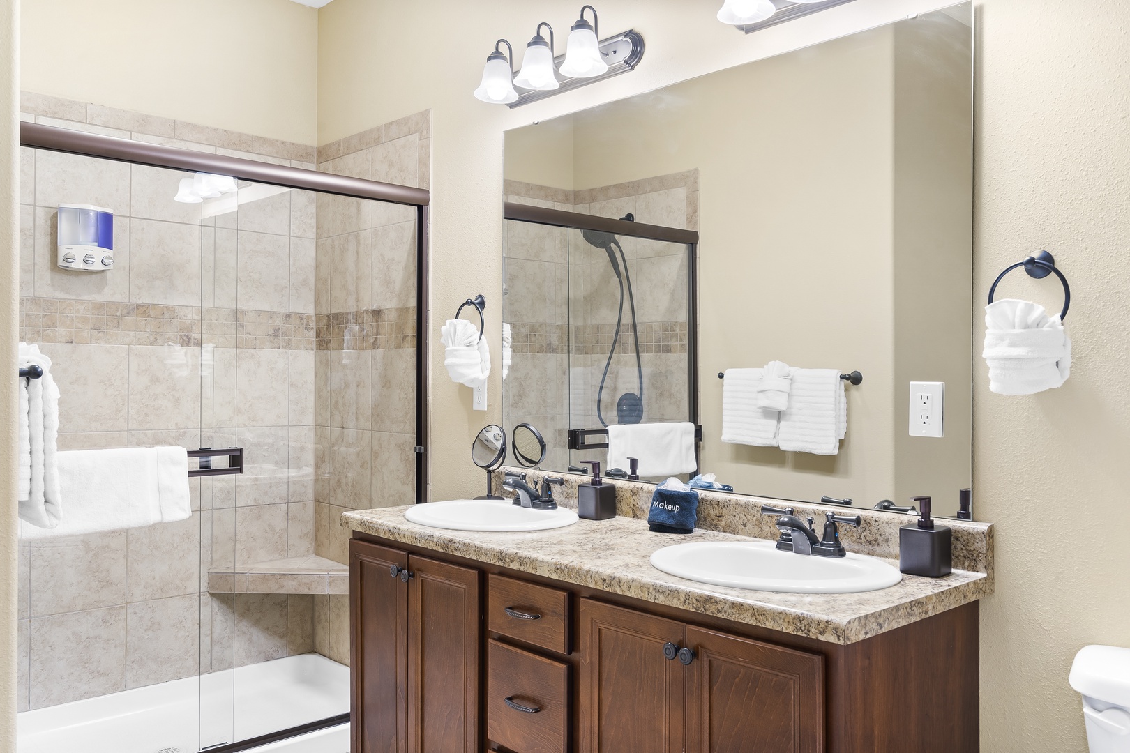 The master ensuite bath offers a double vanity & glass shower