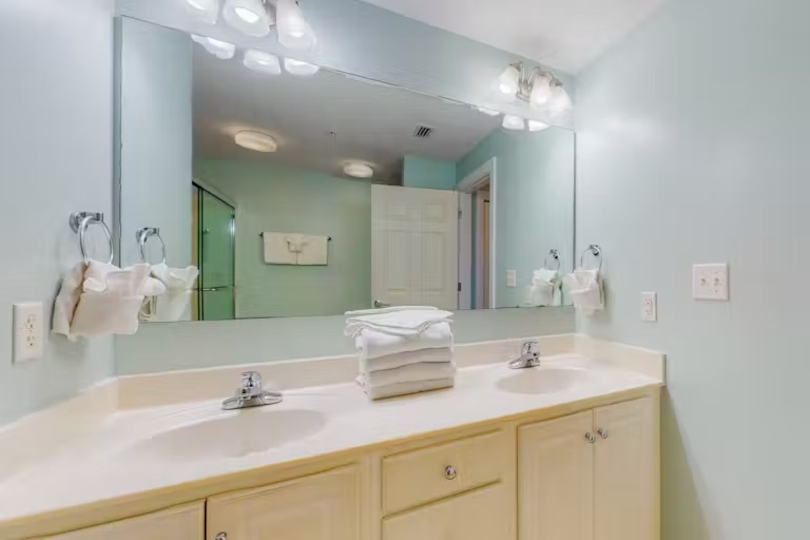 Wash up in the queen ensuite, featuring a double vanity & shower/tub combo