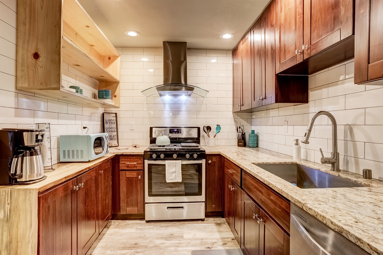 The updated, well-equipped kitchen offers ample space & amenities