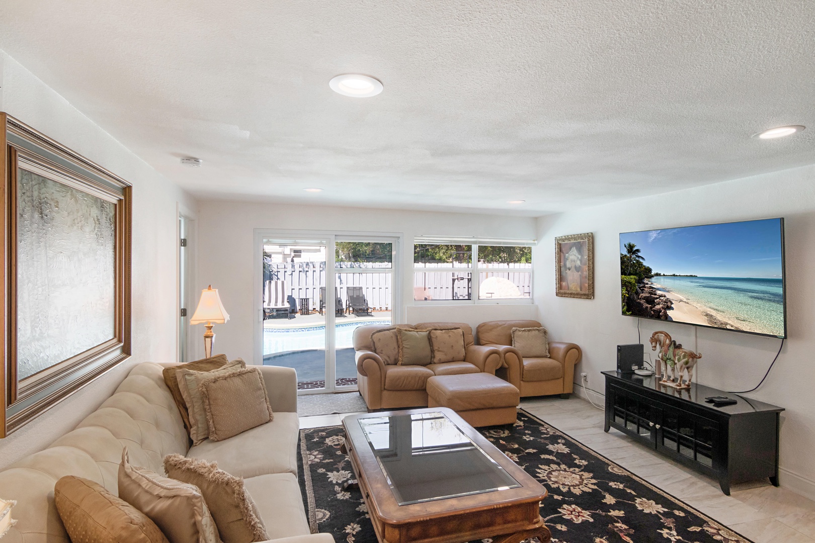 Seating in the living room for up to 6. Pool access only steps away!