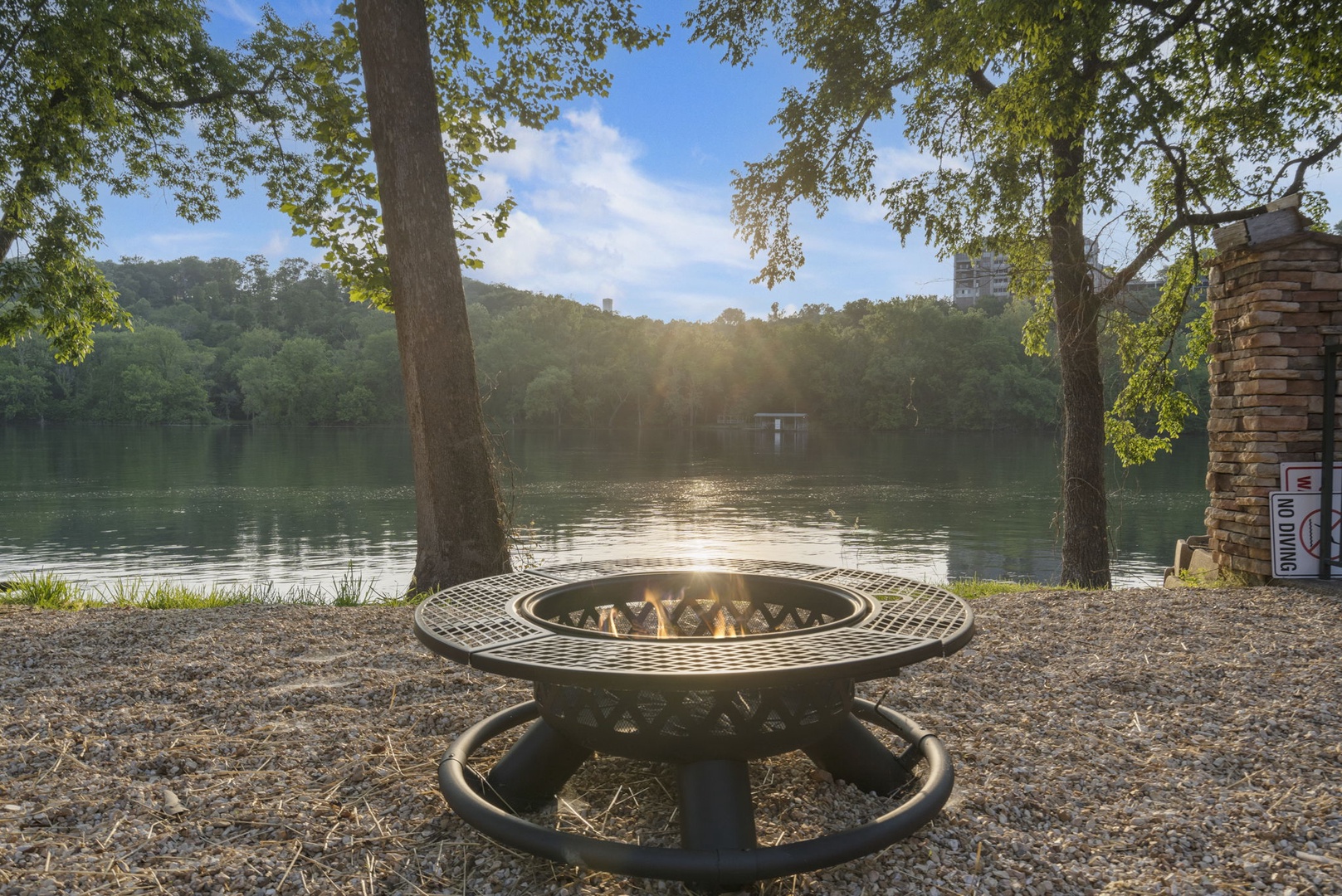 Enjoy tranquil lake views during your visit to Branson from the communal firepit