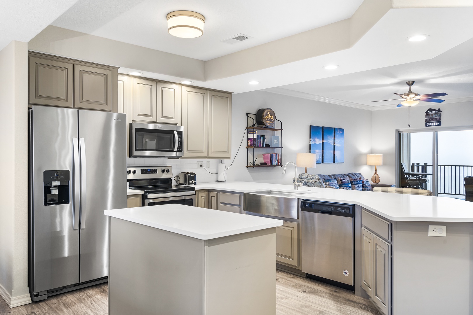 The airy kitchen features beautiful views, ample space, & all the comforts of home