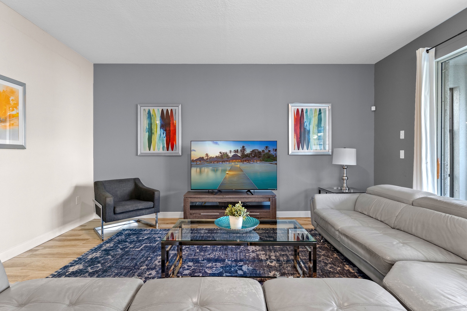 Living area with leather seating and Smart TV