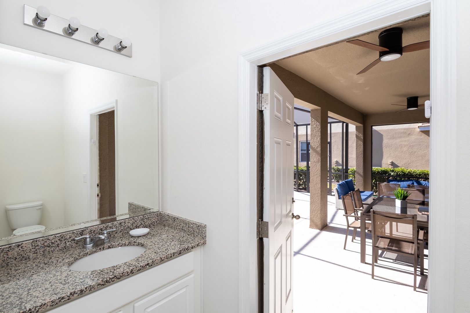 This ensuite bath features a double vanity, glass shower, and soaking tub