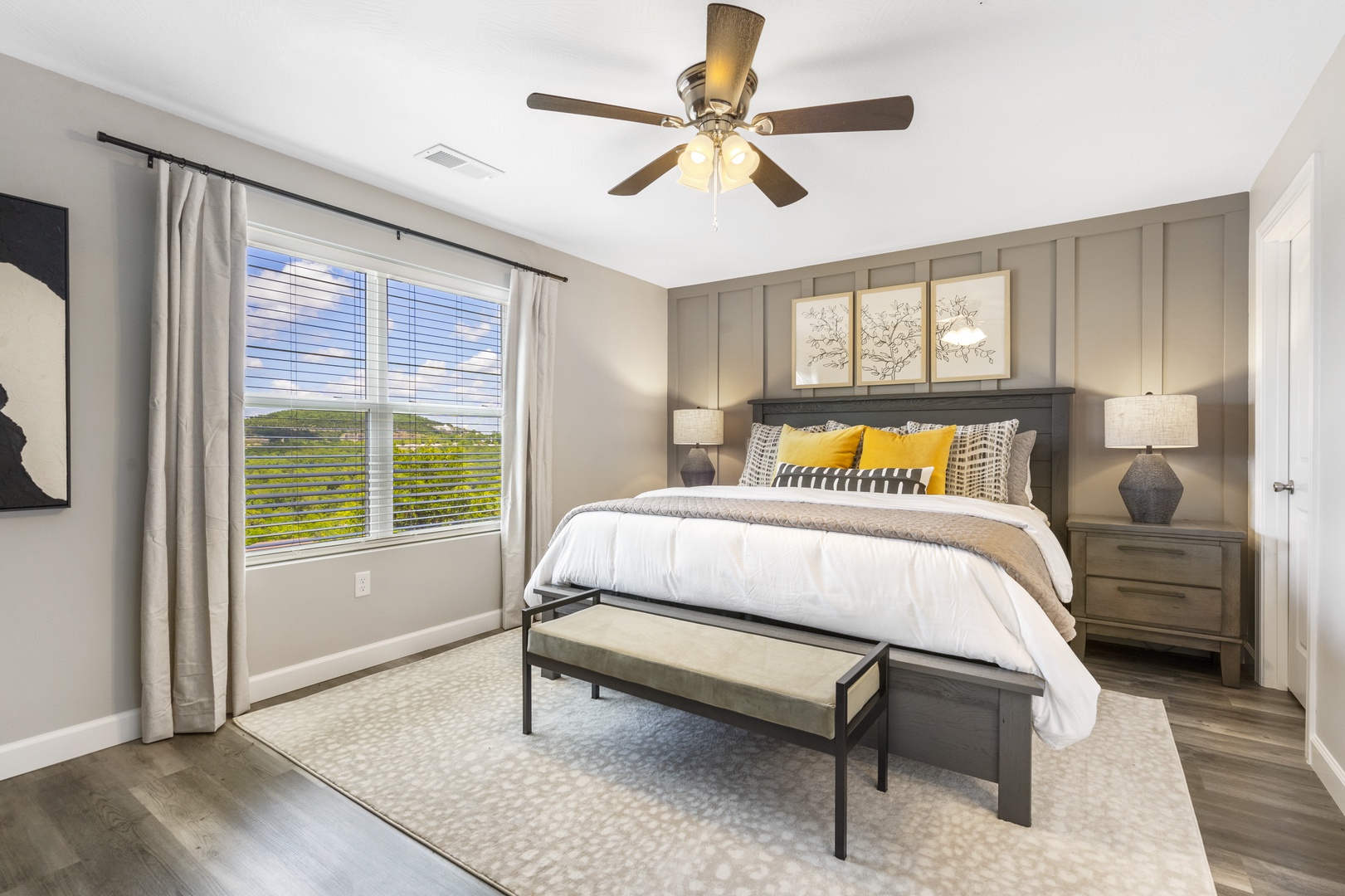 This main-level bedroom sanctuary includes a king bed, smart TV, & ensuite