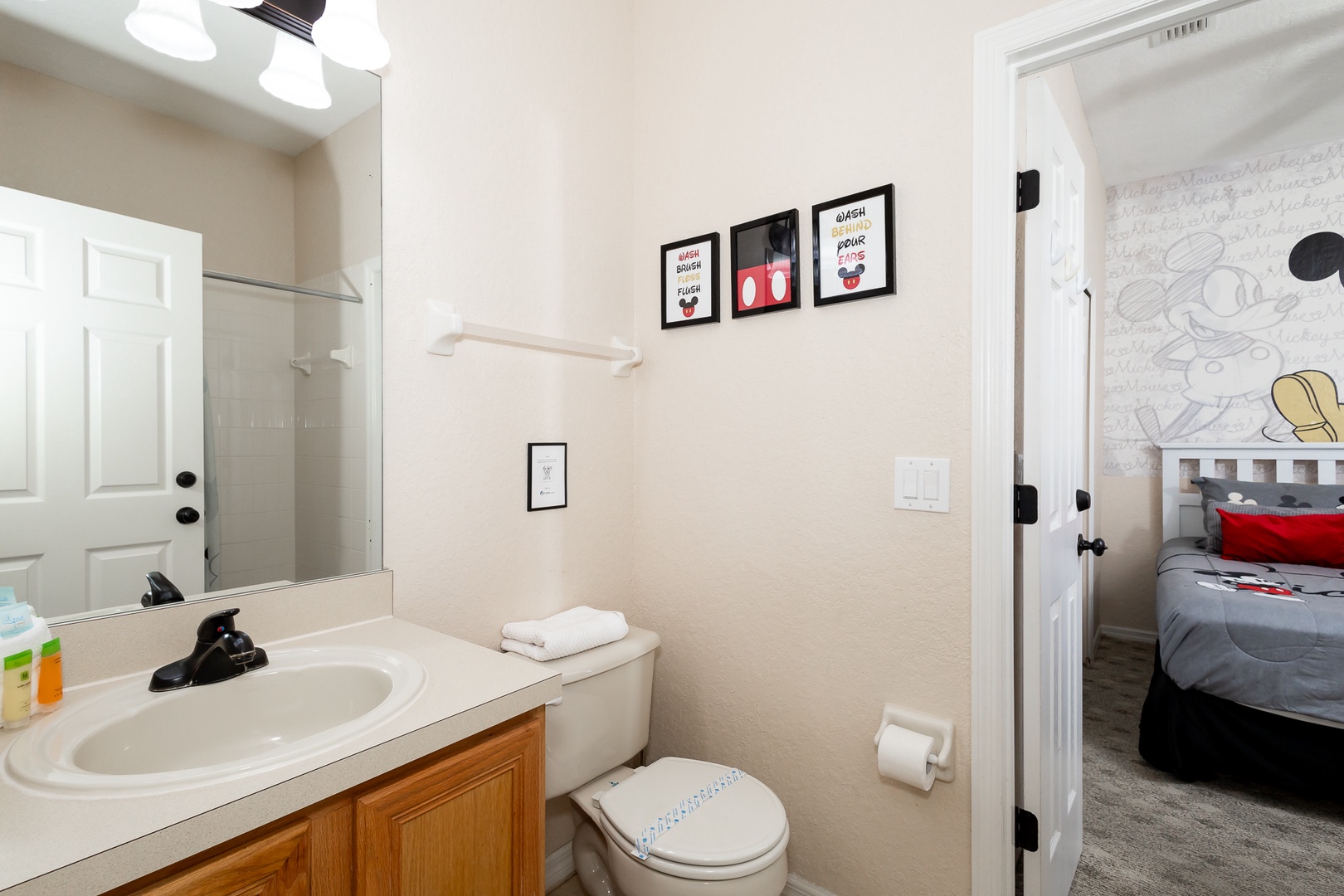 The 1st floor en suite bathroom includes a single vanity & shower/tub combo