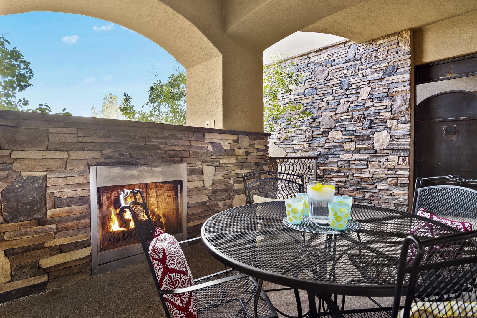 Terrace with outdoor dining, fireplace, and gas BBQ gril