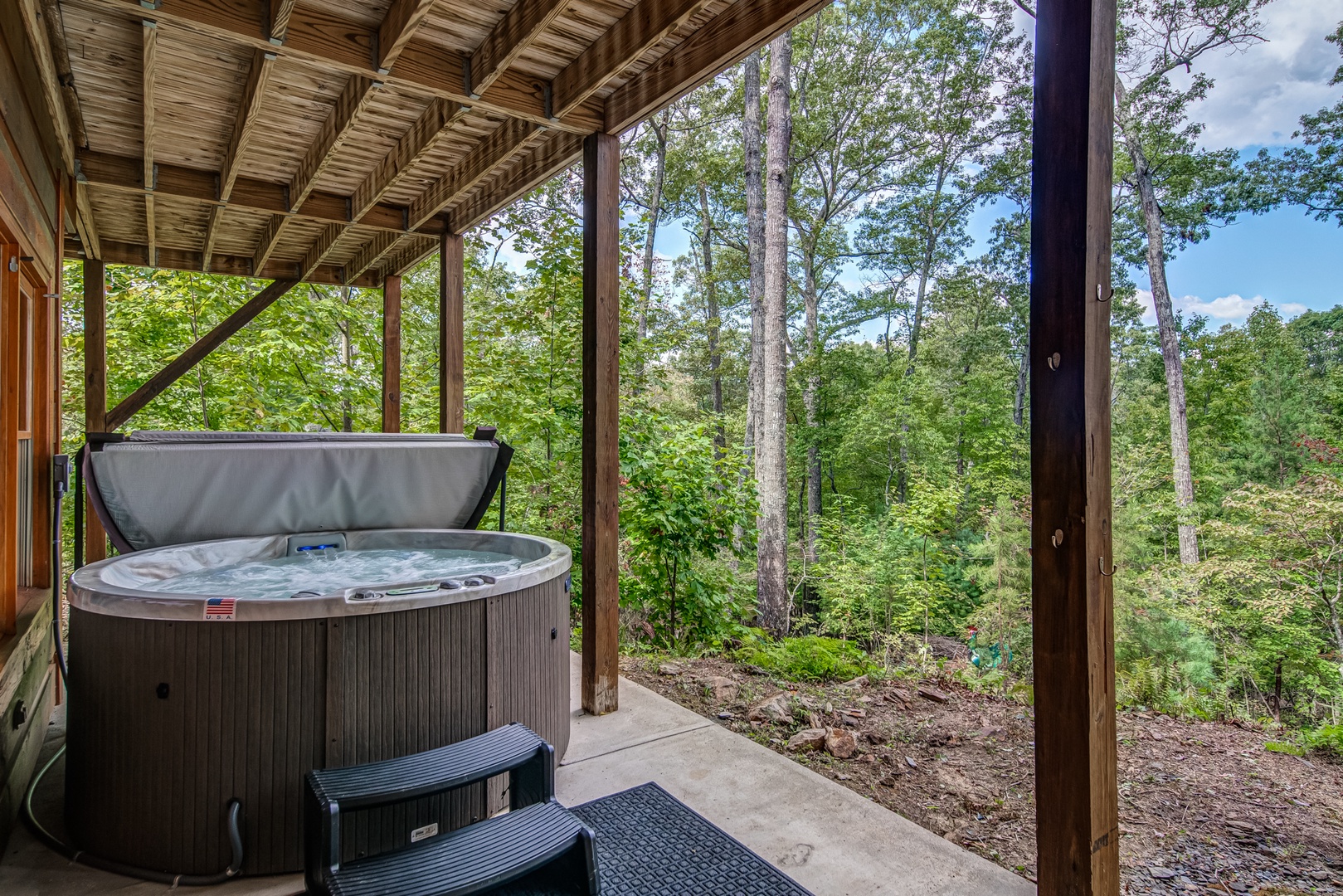 Soak all your cares away with breathtaking views in the private hot tub