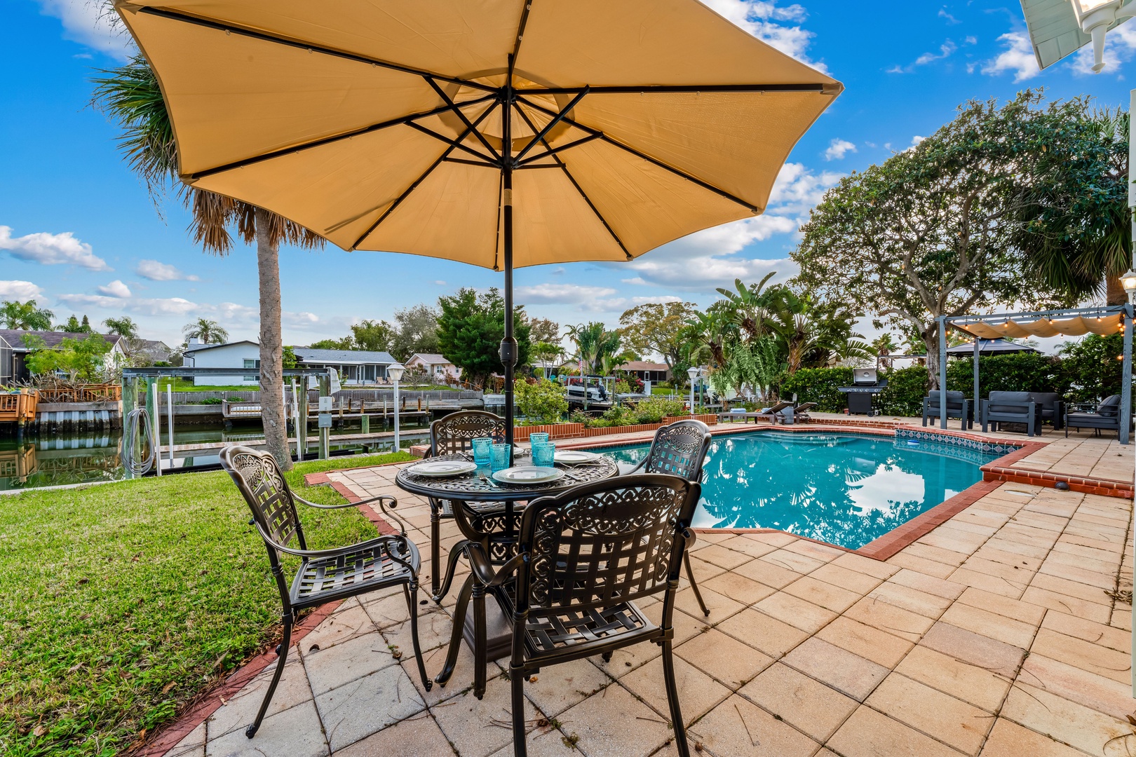 Savor waterside dining on the back patio, just steps from the pool