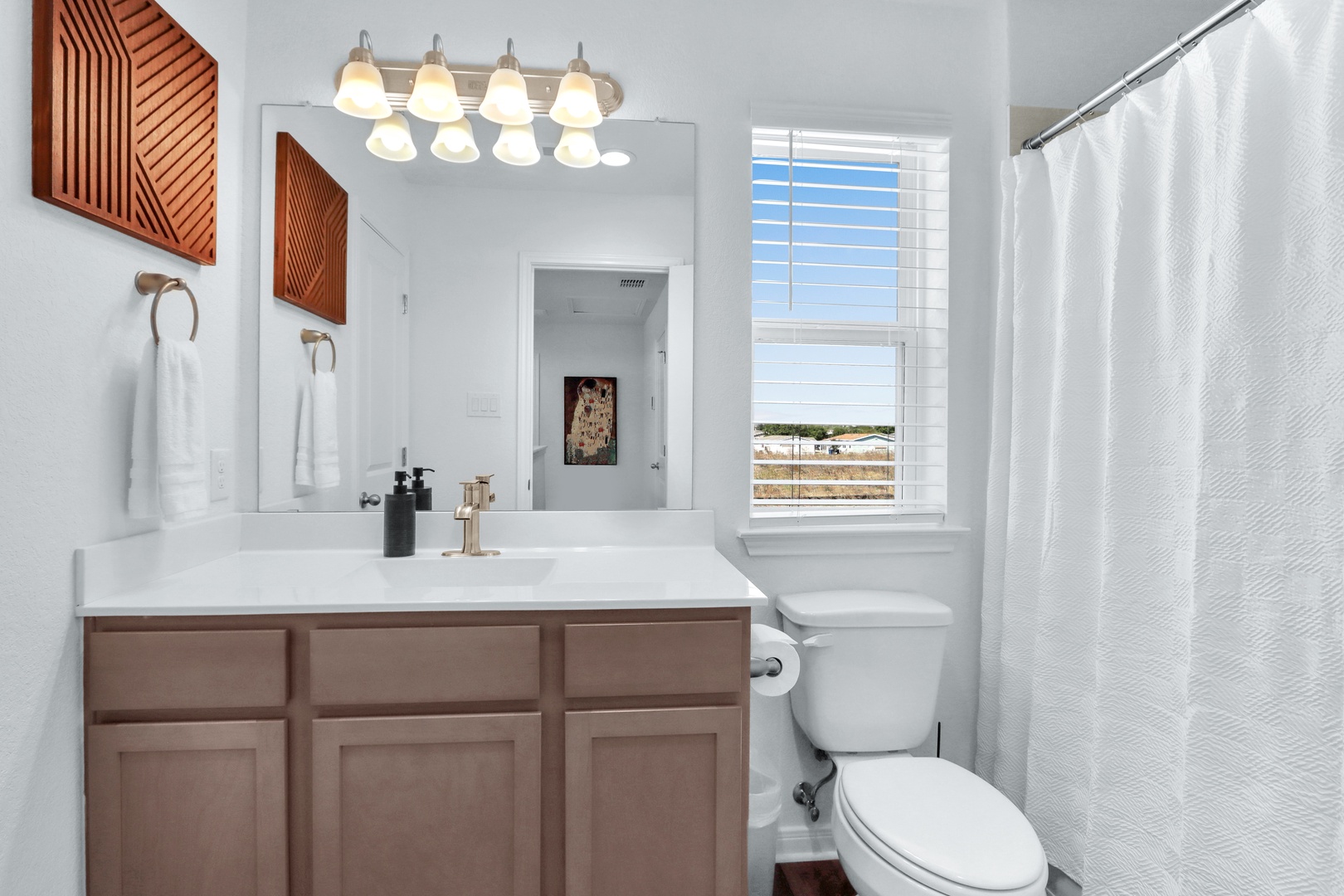 On the 2nd floor, this shared full bath offers a single vanity & shower/tub combo