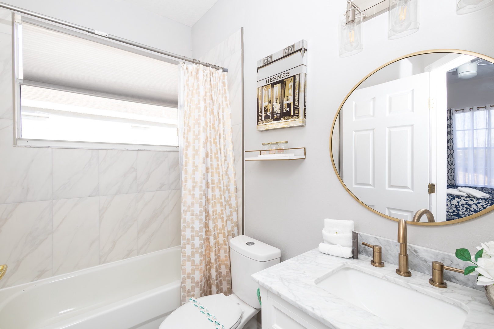 A double vanity, shower/tub combo await in the ensuite bath