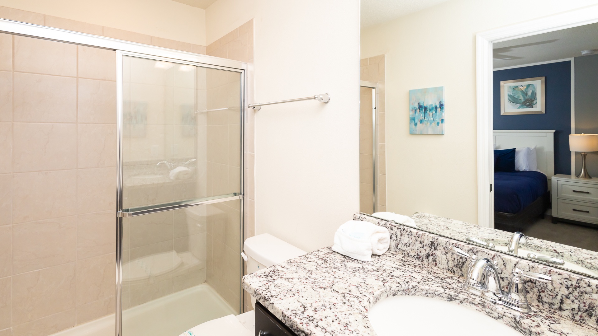 This 2nd floor queen en suite includes a single vanity & glass shower