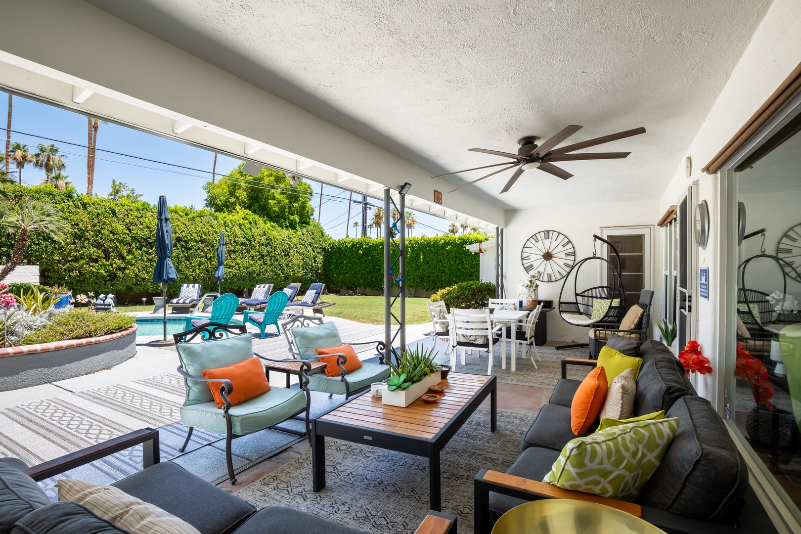 Comfortable outdoor seating by the pool for you and your guests