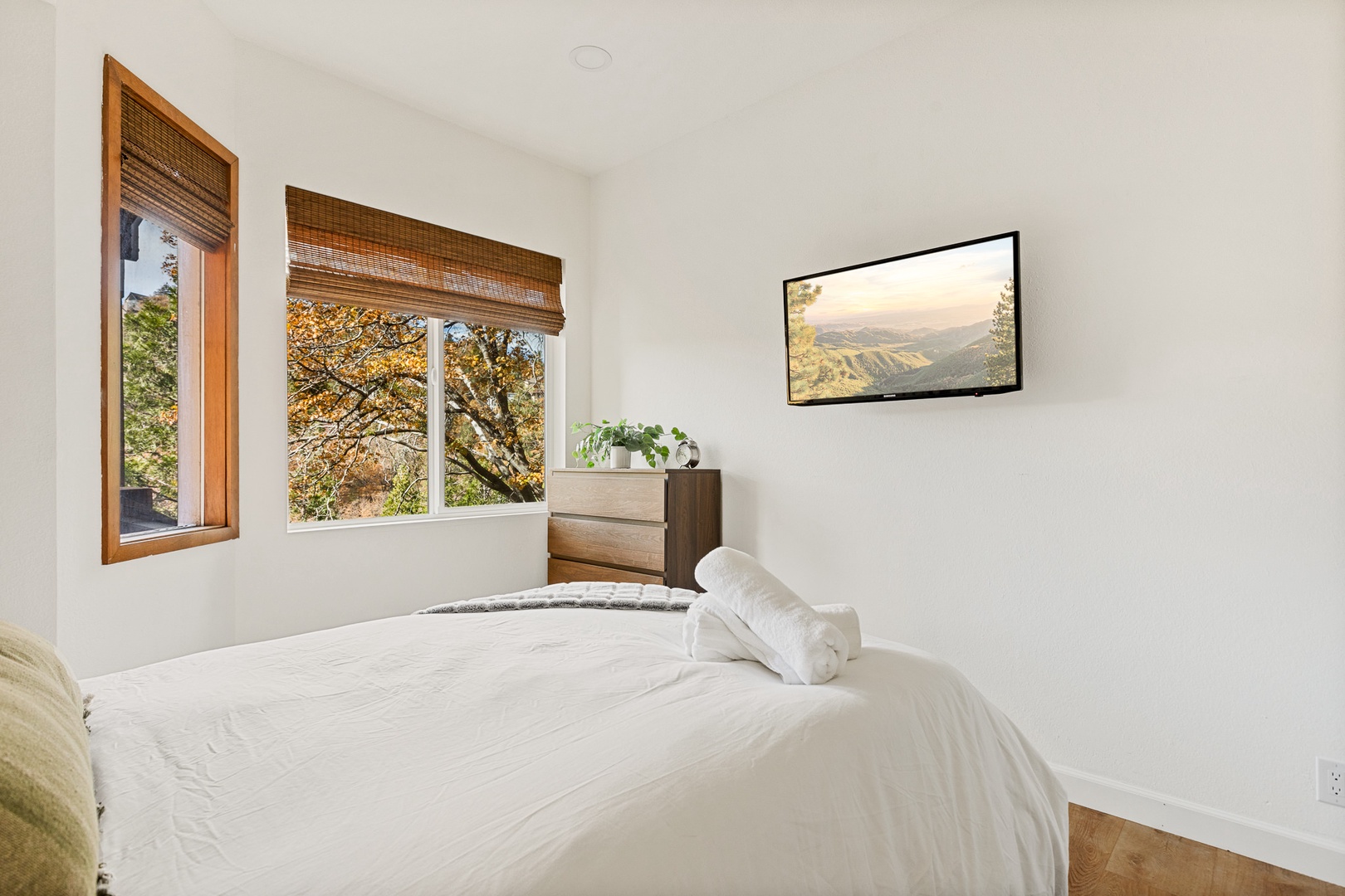 This gorgeous 1st floor bedroom includes a full-sized bed & Smart TV