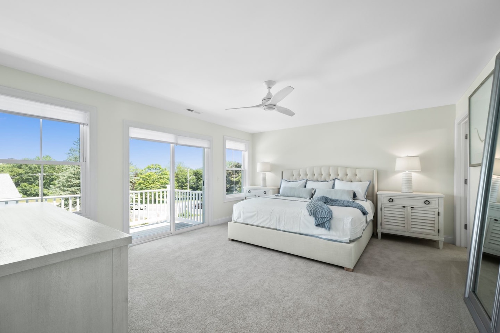 Bedroom 2 with king bed, balcony, Smart TV, and ensuite