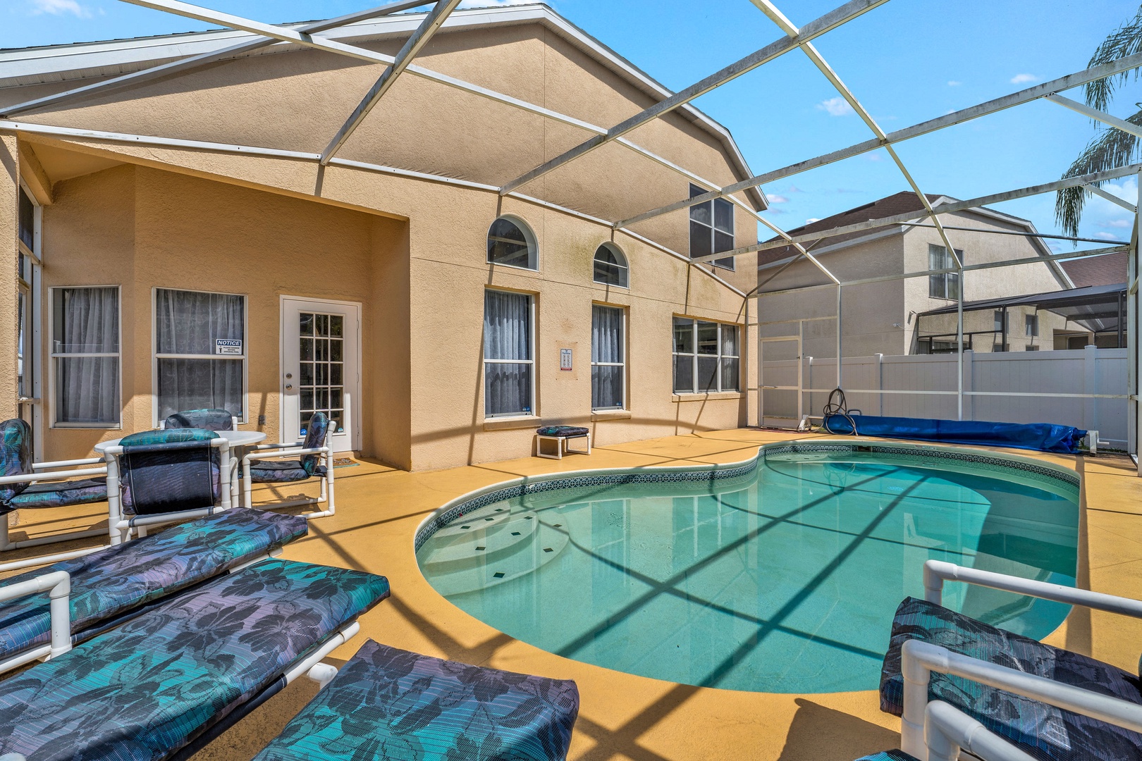 Private screened pool with outdoor seating