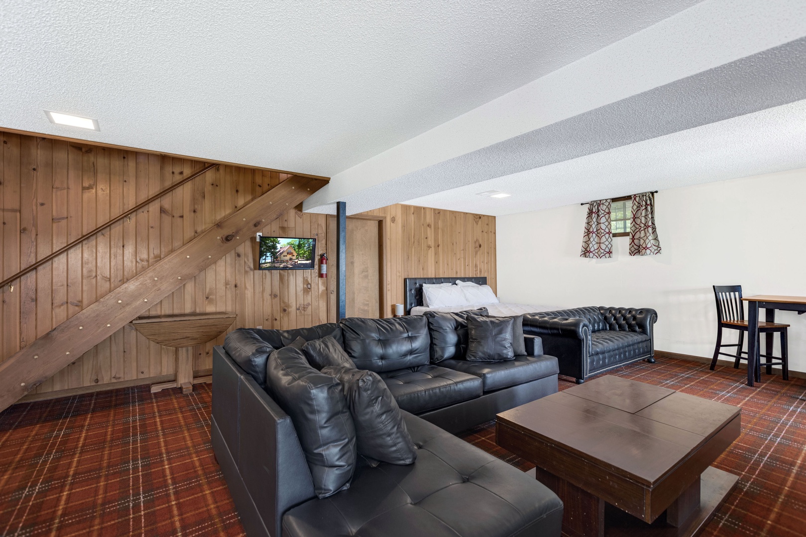 The lower level offers space galore, 1 King, 1 Queen, 1 Twin & room to hang out!