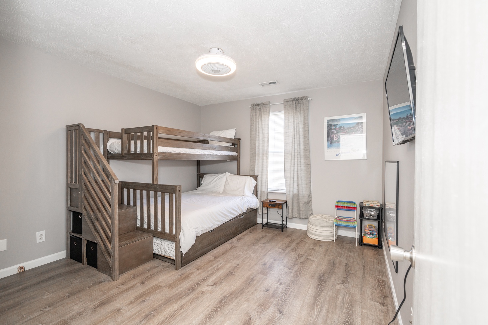 This bedroom offers twin-over-full bunks, as well as a full trundle & Smart TV