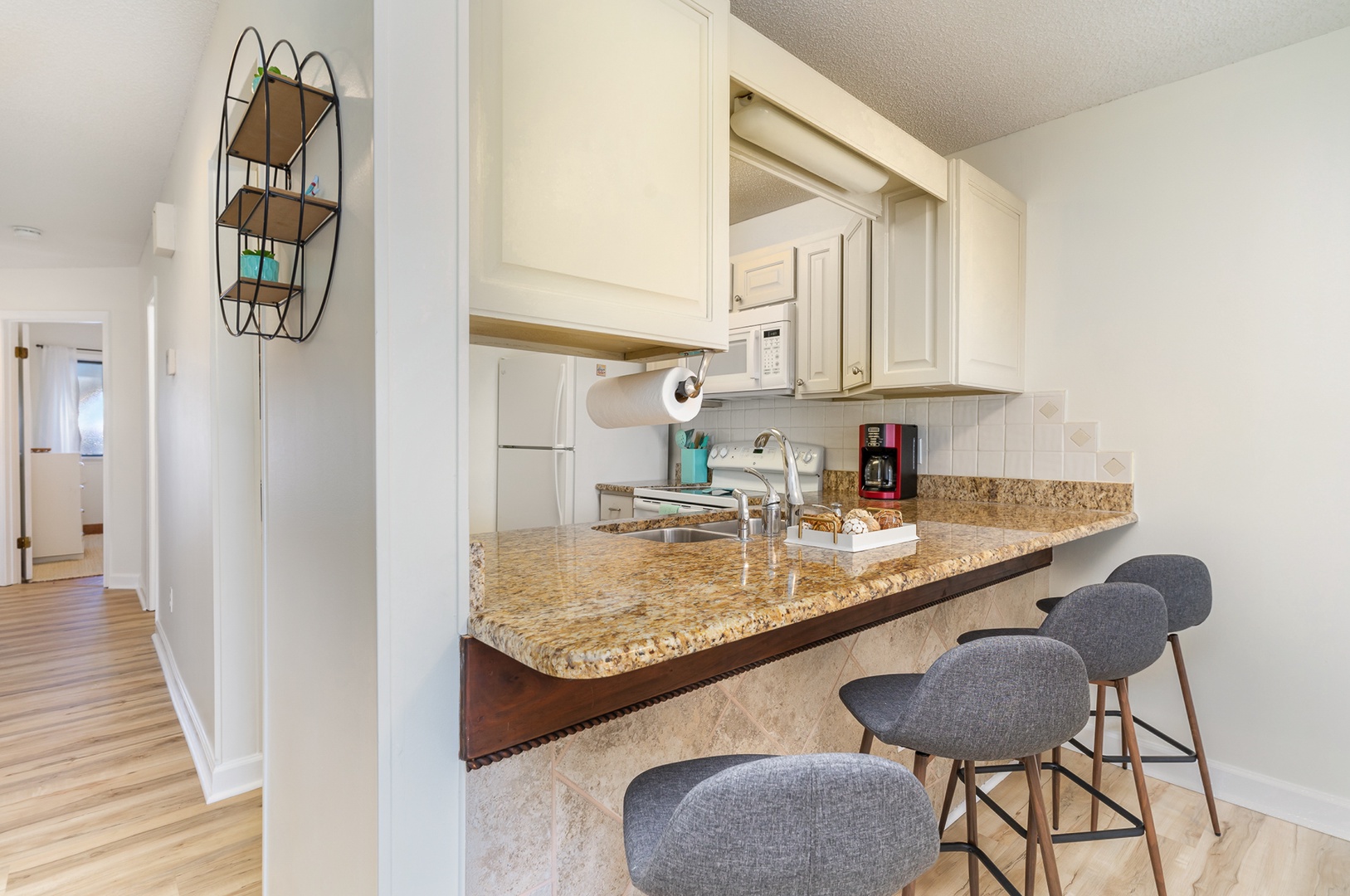 Sip morning coffee or grab a bite at the kitchen counter, seating 4