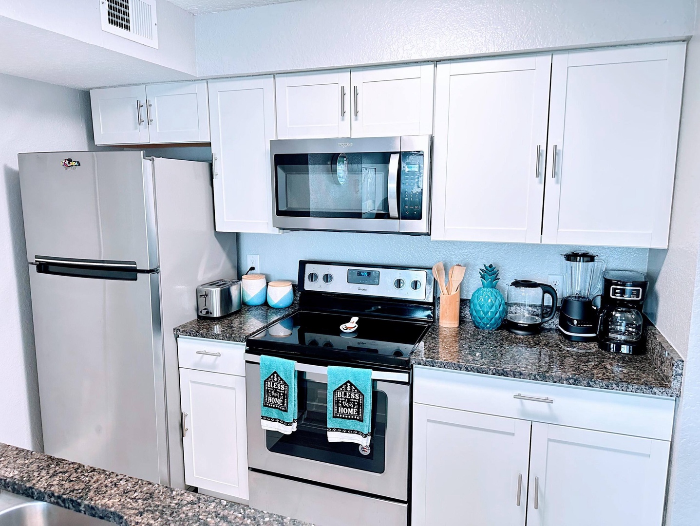 The kitchen offers ample storage space & all the comforts of home