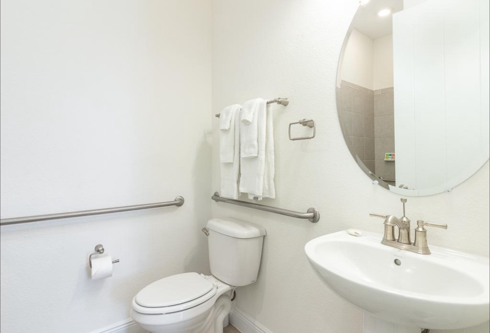 Wash up in this first floor handicap accessible ensuite, featuring a single vanity & roll-in shower