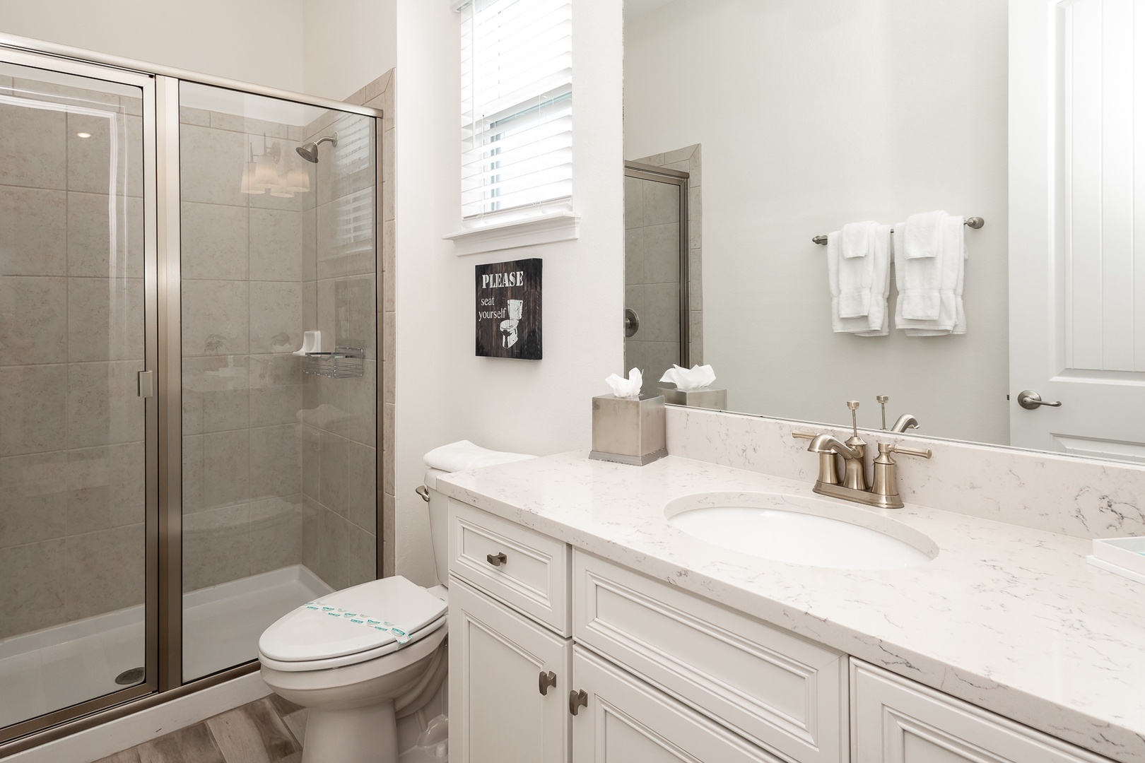 A full bathroom on the 2nd floor offers a spacious single vanity & glass shower