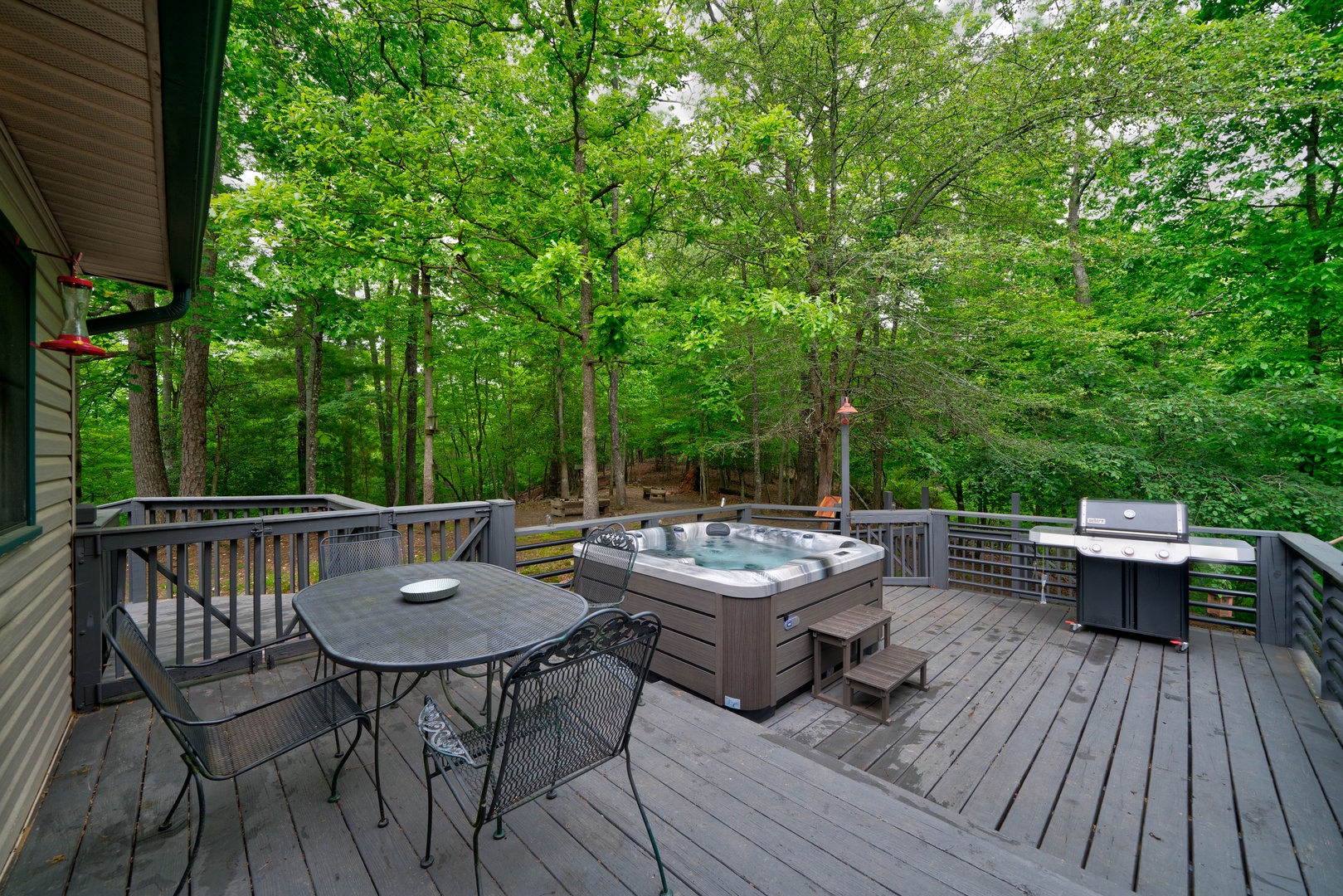 Lounge the day away on the large deck or soak in the brand-new hot tub!