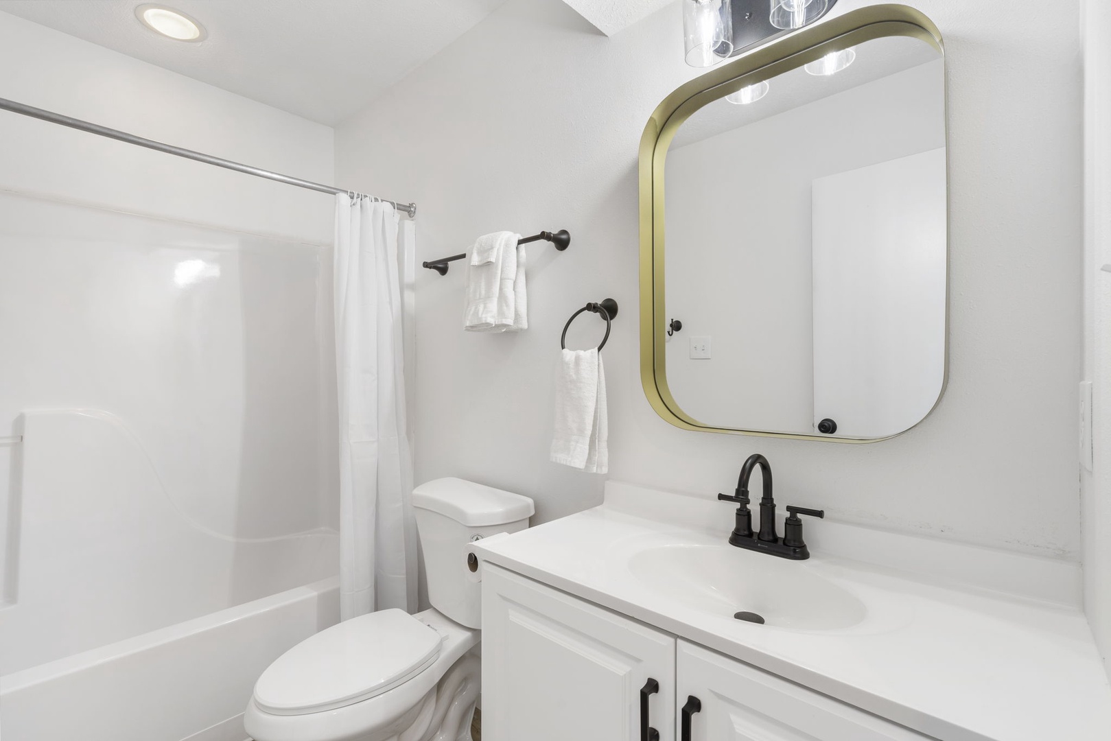 The 2nd floor hall bathroom offers a single vanity & shower/tub combo