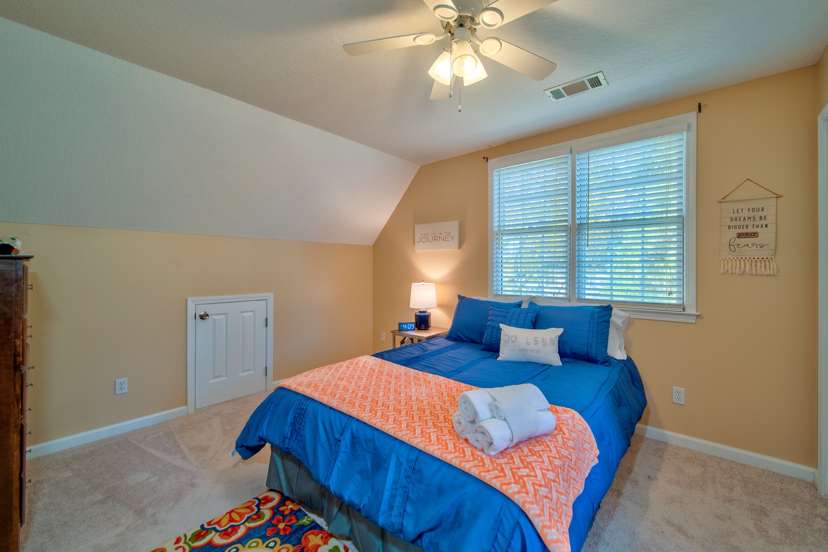 The second of two 2nd floor bedrooms, offering a comfortable queen bed