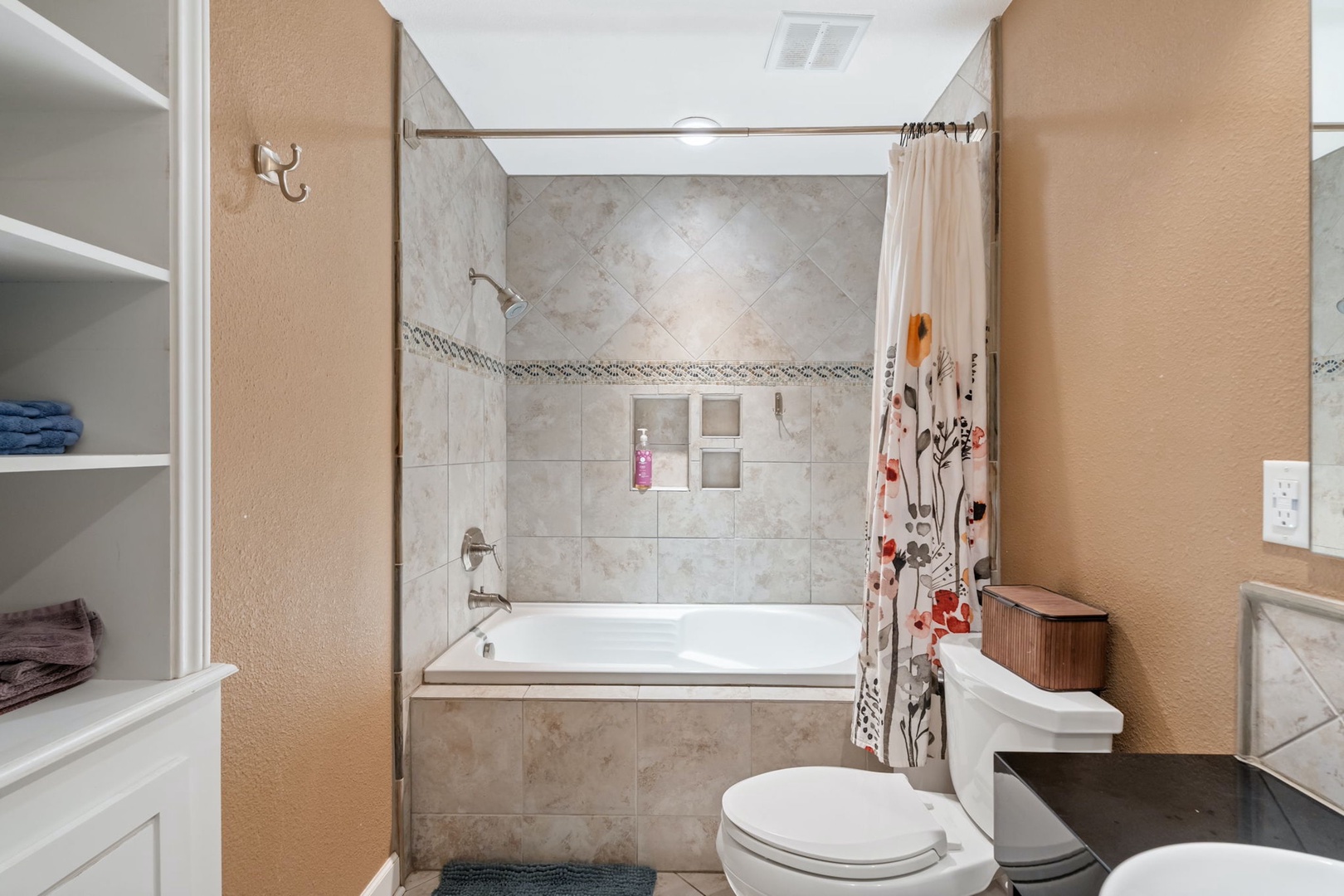 A chic dual vanity & shower/soaking tub combo await in the full bath