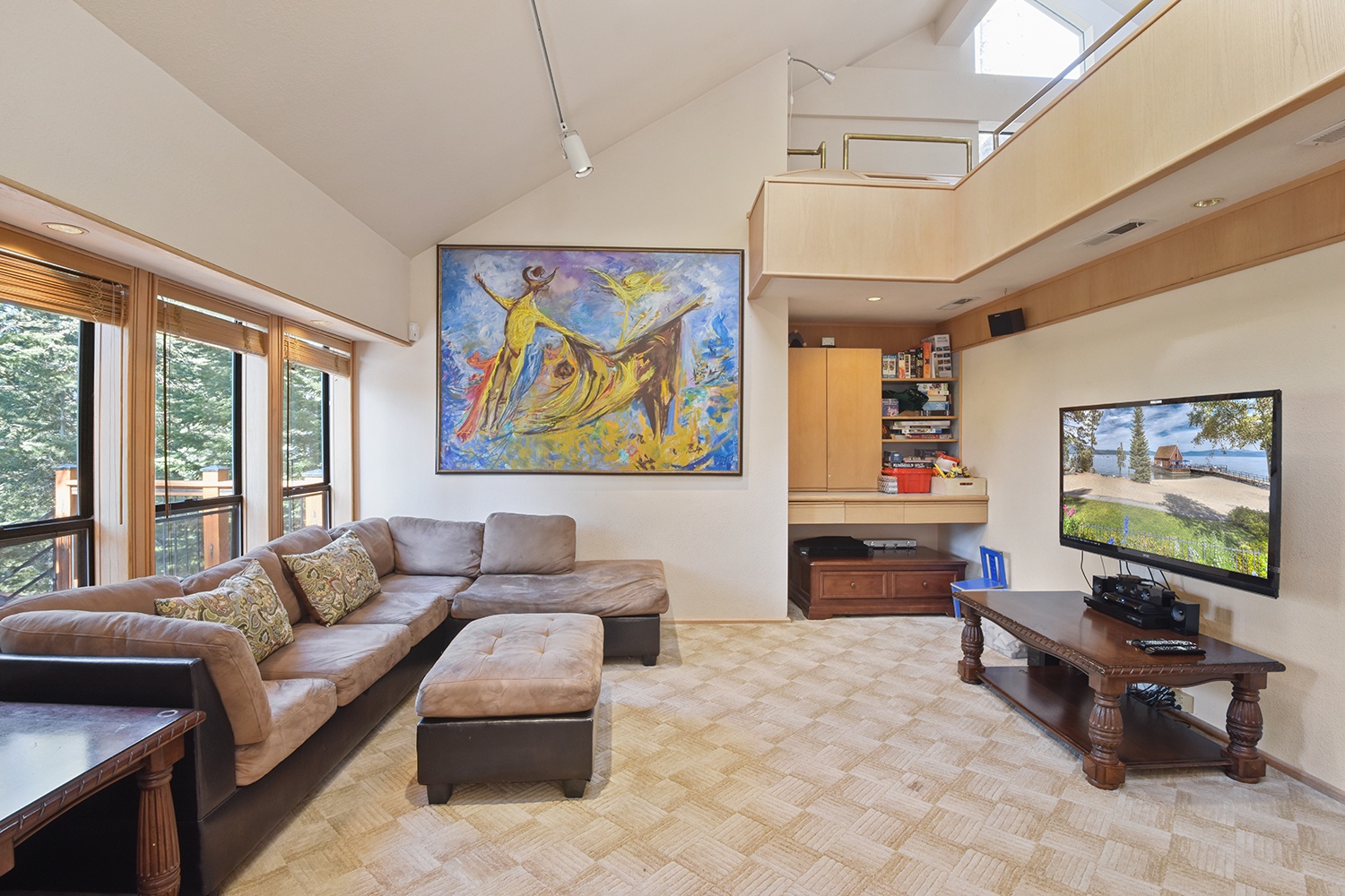 Open living space level 2 with fireplace, Smart TV, and deck