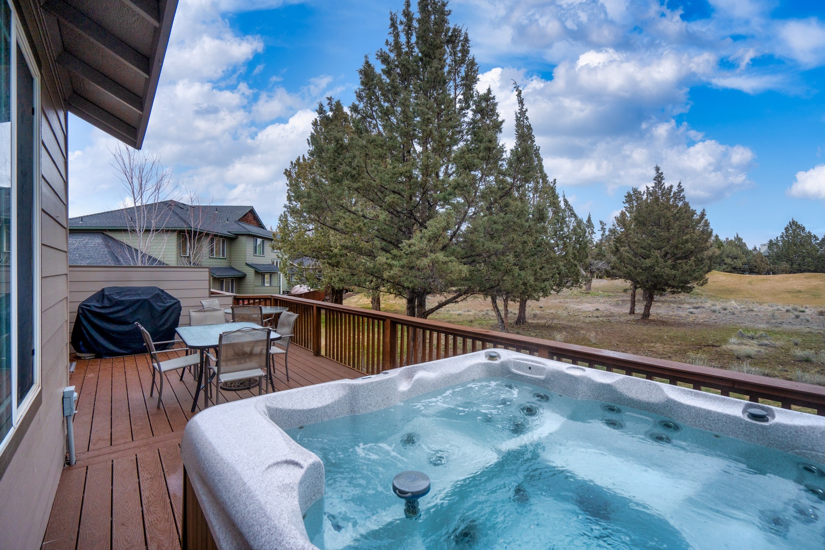 Bask in bubbling bliss with golf course views in the private hot tub!